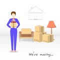 Transportation and home removal. We`re moving. The young women is holding box and books. Boxes, armchair, lamp, books in anticip Royalty Free Stock Photo