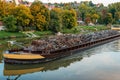 Transportation industry. Ship barge transports scrap metal and sand with gravel. Barge loaded with scrap metal is on the Royalty Free Stock Photo