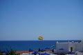 Parasailing in the Mediterranean. Parasailing is a recreational kiting activity where a person is towed behind a vehicle. Rhodes Royalty Free Stock Photo