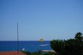 Parasailing in the Mediterranean. Parasailing is a recreational kiting activity where a person is towed behind a vehicle. Rhodes Royalty Free Stock Photo