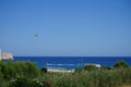 Parasailing in the Mediterranean. Parasailing is a recreational kiting activity where a person is towed behind a vehicle. Rhodes Royalty Free Stock Photo