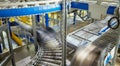 Transportation line conveyor roller with containers in motion Royalty Free Stock Photo