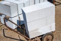 Transportation and storage of aerated concrete blocks, bricks. Laying aerated concrete blocks. Royalty Free Stock Photo