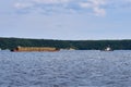 Transportation of timber along the river by barge and tug Royalty Free Stock Photo