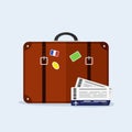 Transportation and travel. Suitcase with stickers, airplane tickets. Vacation tourism.