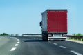 Transportation Truck on country highway under blue sky Royalty Free Stock Photo