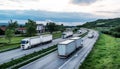 Transportation trucks passing by on asphalt highway Royalty Free Stock Photo