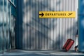 Transportation and Vacation Concept, Traveler Walking with Suitcase and Follow the Departures Sign in the Airport