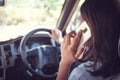 Transportation and vehicle concept - man using phone while driving the car Royalty Free Stock Photo