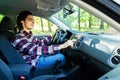 Transportation and vehicle concept. Young man using car audio stereo system Royalty Free Stock Photo