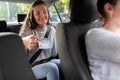 female passenger giving money to taxi car driver Royalty Free Stock Photo