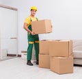 Transportation worker delivering boxes to house Royalty Free Stock Photo