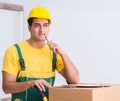 Transportation worker delivering boxes to house