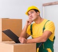 Transportation worker delivering boxes to house Royalty Free Stock Photo