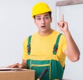 Transportation worker delivering boxes to house Royalty Free Stock Photo