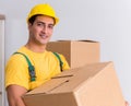 Transportation worker delivering boxes to house Royalty Free Stock Photo