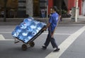 Transporting drink barreled water with cart Royalty Free Stock Photo