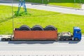 Transporting huge dump truck tire wheels in a container