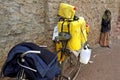 Transporting milk in cans on bike