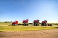 Transporting three new red trucks Royalty Free Stock Photo