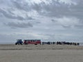 Transporting tourists by tractor Sandormen to the cape Grenen in Skagen