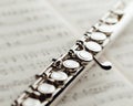 Transverse flute on music sheet Royalty Free Stock Photo