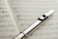 Transverse flute on music sheet Royalty Free Stock Photo