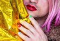 Transvestite man with lipstick and polish