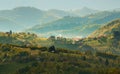 Transylvania rural landscape with a Romanian traditional village on the hills - Morning Mist Royalty Free Stock Photo