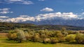 Transylvania village with Carpathian mountains in the background in autumn time , Romania