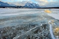 Trapped methane bubbles frozen into the water under the thick cracked and folded ice on Abraham Lake, located in the Kootenay Royalty Free Stock Photo