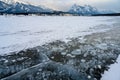 Trapped methane bubbles frozen into the water under the thick cracked and folded ice on Abraham Lake, located in the Kootenay Royalty Free Stock Photo