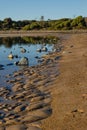 Trapped water in a beach lagoon at low tide Royalty Free Stock Photo