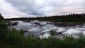 Trappstegsforsen waterfall at sunset on the Wilderness Road in Vasterbotten, Sweden