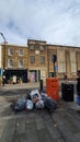 Trash bags on a street in london