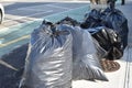 Trash Bags Waiting to be Picked Up on New York City Curb Royalty Free Stock Photo