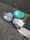 Trash bags wrongly discarded on a street of Sao Paulo's Liberdade district.