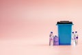 Trash bin. Blue dustbin for recycle plastic trash isolated on pink background. Container for disposal garbage waste and Royalty Free Stock Photo