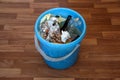 Trash bin with leftover food and chicken bones Royalty Free Stock Photo