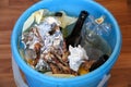 Trash bin with leftover food and chicken bones, close-up Royalty Free Stock Photo