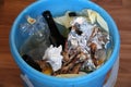 Trash bin with leftover food and chicken bones, close-up Royalty Free Stock Photo