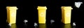 Trash bin set. Yellow dustbin for recycle plastic, paper and glass can trash isolated on black background. Container for Royalty Free Stock Photo