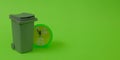 Trash can and a clock showing 5 minutes before 12 on a bright green background. Text space. Environmental protection concept. Royalty Free Stock Photo