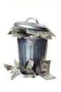 Trash can full of money Royalty Free Stock Photo