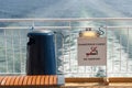 Trash can and warning sign on aft deck of RoRo passenger ferry Color Line SuperSpeed 1 (IMO 9374519)..