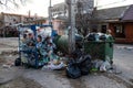 Trash cans full of trash on the streets of Kherson, Ukraine - March 21, 2023