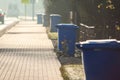 Garbage cans in line on the side of the road. Environmental protection concept Royalty Free Stock Photo