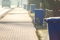 Garbage cans in line on the side of the road. Environmental protection concept Royalty Free Stock Photo