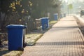 Garbage cans in line on the side of the road. Environmental protection concept Royalty Free Stock Photo