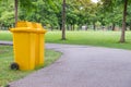 trash cans in the park beside the walk way Royalty Free Stock Photo